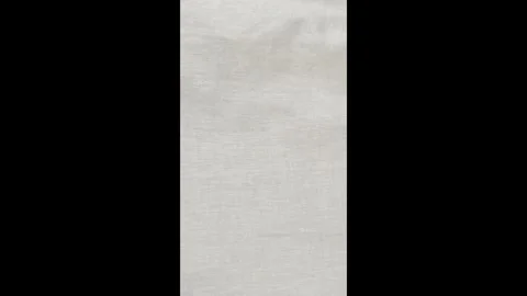 Abstract soft beige linen background. Flowing natural linen fabric in neutral Stock Footage 313087419