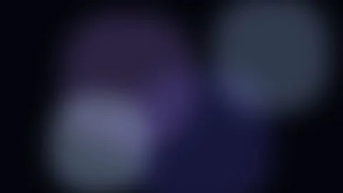Abstract soft blue and purple circular light orbs on a dark black background Stockbeeldmateriaal 338310617
