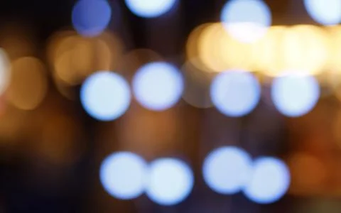 Abstract soft defocused bokeh lights with colorful glowing circles and warm.. Stock Photos