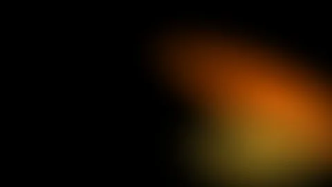 Abstract soft glowing orange light leak on a deep black background texture Video stock 336263333