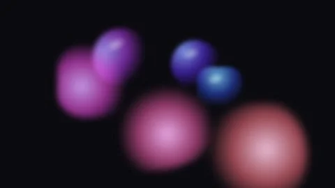 Abstract soft glowing spheres of pink and purple against a black background Stock Footage 335145762