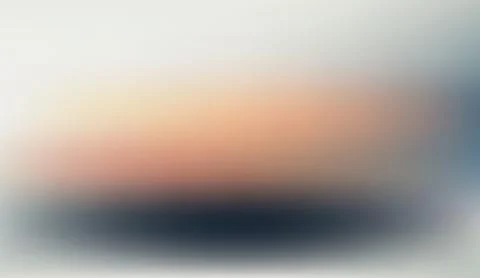 Abstract soft gradient background with glowing warm sunset colors and dark Ilustração Stock