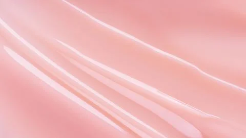 Abstract soft pink fluid texture with flowing lines and glossy finish. Minima Stock Photos