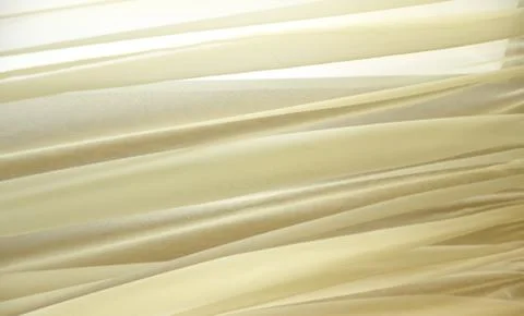 Abstract soft yellow lemon background made of light fabric. Stock Photos