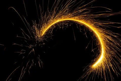 Abstract sparkler firework light on black background Stock Photos