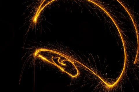 Abstract sparkler firework light on black background Stock Photos