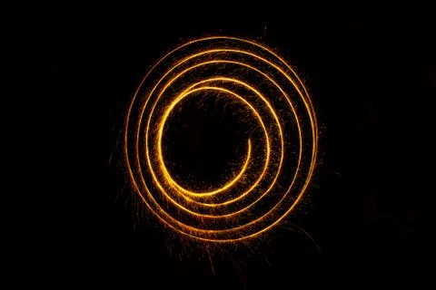 Abstract sparkler firework light on black background Stock Photos