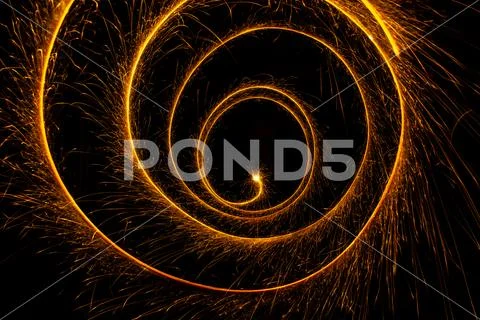 Abstract sparkler firework light on black background Stock Photos