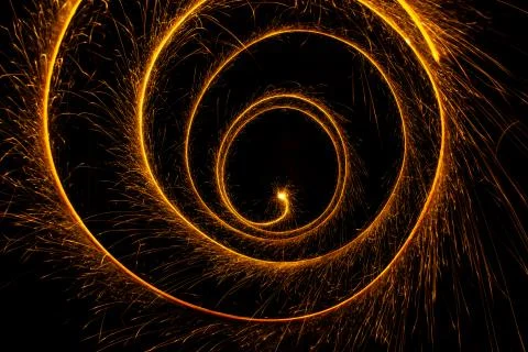Abstract sparkler firework light on black background Stock Photos