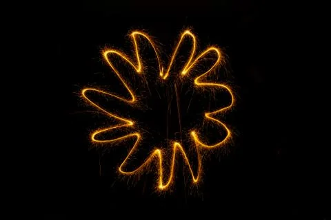 Abstract sparkler firework light on black background Stock Photos