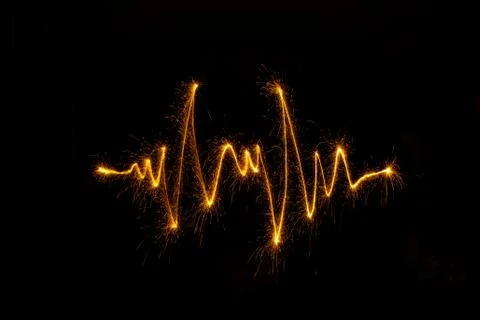 Abstract sparkler firework light on black background Stock Photos