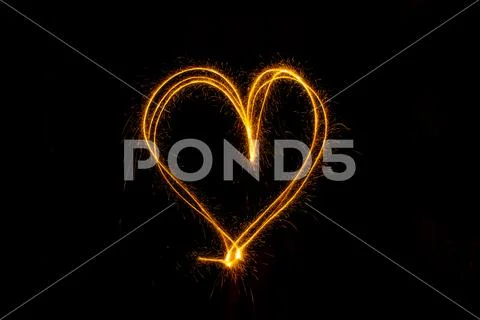 Abstract sparkler firework light on black background Stock Photos