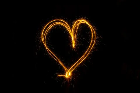 Abstract sparkler firework light on black background Stock Photos