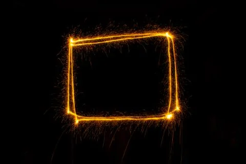Abstract sparkler firework light on black background Stock Photos
