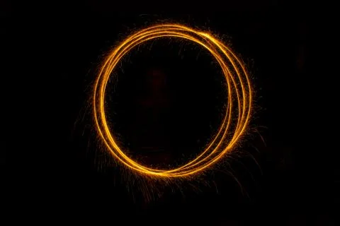 Abstract sparkler firework light on black background Stock Photos