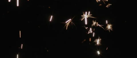 Abstract sparklers burning in the black background. Holiday, celebration conc Stock Footage 132968506