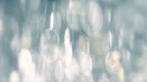 Abstract sparkles or glitter lights. Defocused circles bokeh or particles. Loop Stock Footage 81676418