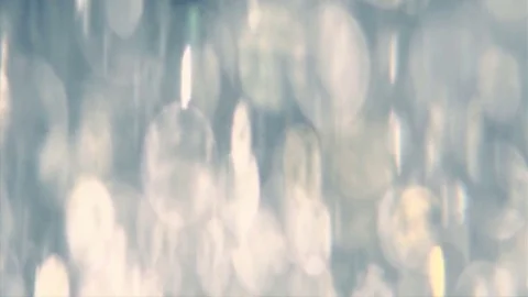 Abstract sparkles or glitter lights. Defocused circles bokeh or particles. Loop Stock Footage 81676475