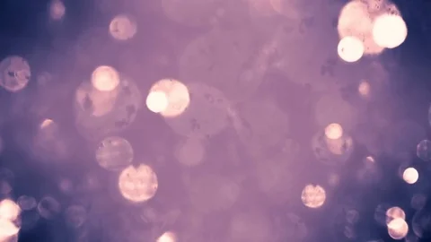 Abstract sparkles or glitter lights. Defocused circles bokeh or particles , p Stock Footage 82500660