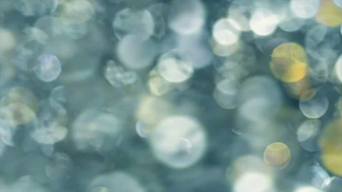 Abstract sparkles or glitter lights. Defocused circles bokeh or particles Stock Footage 91993360