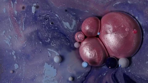 Abstract spheres, molecules, cells. Movement of paint bubbles in the oil. Stock Footage 169718745