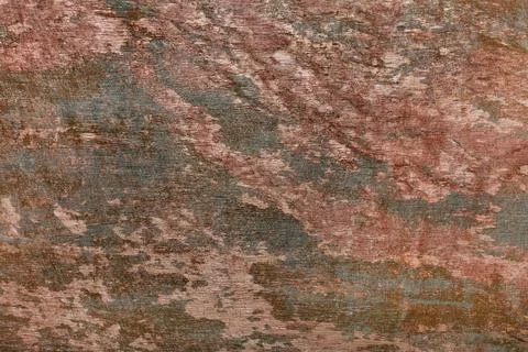 Abstract spotted pattern on the wall with the texture of brown and green plas Stock Photos