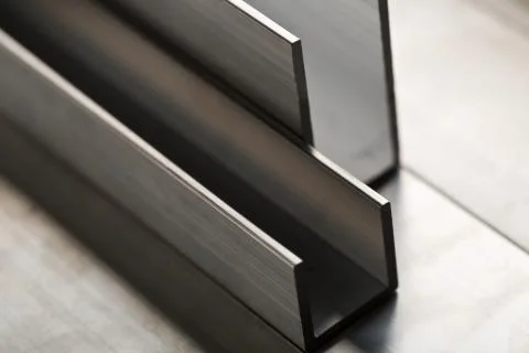 Abstract stack of aluminium profiles close up, industrial background macro 스톡 사진