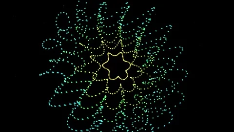 Abstract star pattern formed by drone light show moving in darkness cinemat.. Vídeo Stock 344651736