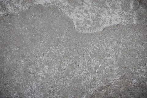 Abstract stone background. The texture of the stone wall. Close-up. Light gra Stock Photos