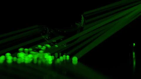 Abstract stream of spherical particles reflected from a large black circular Illustrazione stock