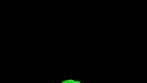 Abstract stylized Green ink drop in water on a black background V7 Stock Footage 87565257