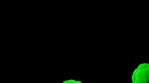 Abstract stylized Green ink drop in water on a black background V17 Stock Footage 87565285