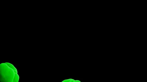 Abstract stylized Green ink drop in water on a black background V19 Stock Footage 87565288