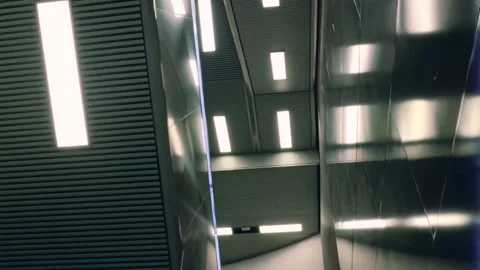 Abstract Subway Ceiling With Repeating LED Lights and Steel Reflections Stock Footage 335442201