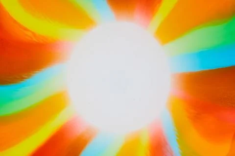 Abstract sun with rays of green and blue and orange and red and yellow Stockfoto's