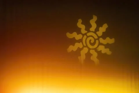 Abstract sun shape projecting warm yellow energy glow Stock Photos
