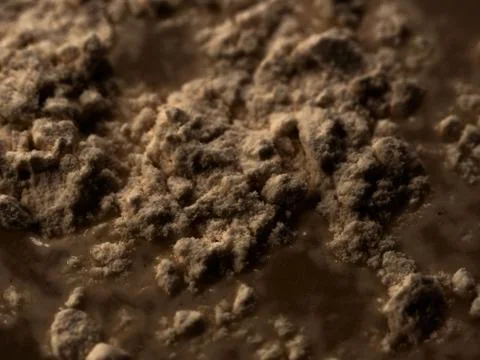 Abstract surface - rugged and rough heap and mound of brown dark substance Stock Photos