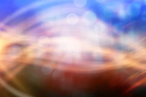 Abstract swirling light patterns are creating flow with bokeh circles on dark Foto stock