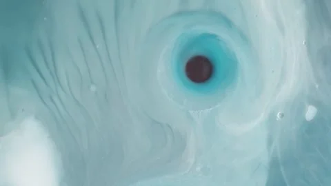 Abstract swirling liquid marble paint mixture creating hypnotic eye pattern. Stockbeeldmateriaal 337760586
