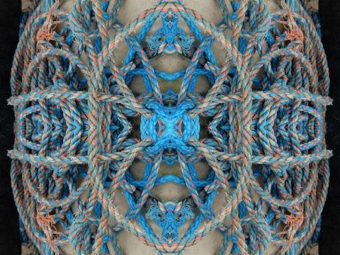 Abstract symmetric pattern of fishnet and fishing lines Foto stock