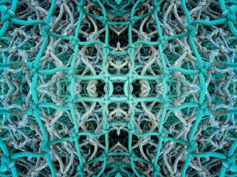 Abstract symmetric pattern of fishnet and fishing lines Foto stock