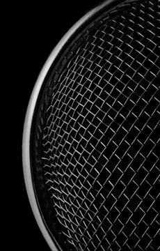 A  abstract tea strainer in close-up against black background Stock-Fotos