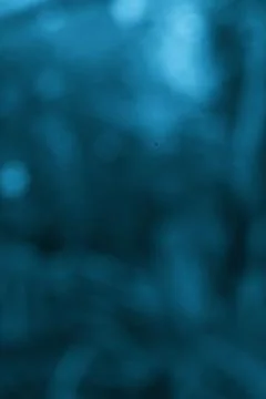 Abstract teal background texture showcasing blurred shapes and smooth color.. Stock Photos