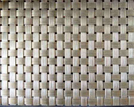 Abstract textural brown background uniform wicker surface Stock Photos