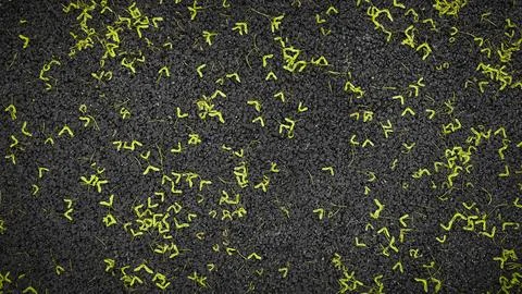 Abstract texture of black surface with scattered yellow shapes Stockfoto's