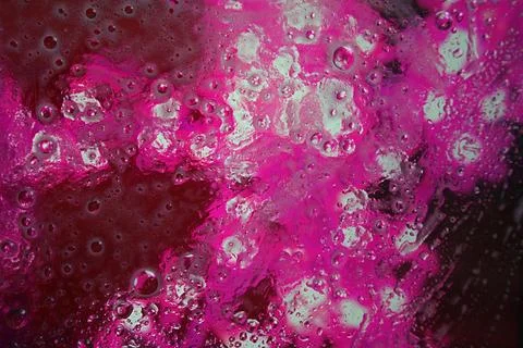 An abstract texture in bright pink with bubbles or glitter Stock Photos