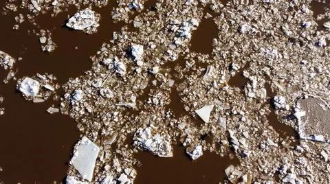 Abstract texture of broken white ice and dark water at winter. Foto stock