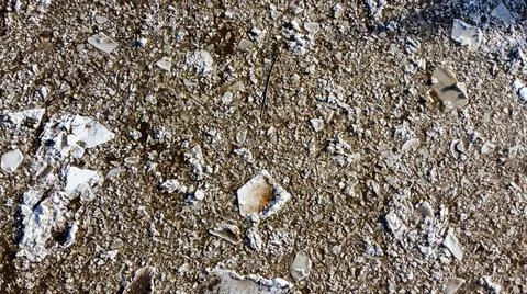 Abstract texture of broken white ice and dark water at winter. Spring is coming. Stock Photos