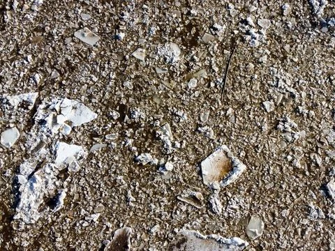 Abstract texture of broken white ice and dark water at winter. Spring is coming. Stock Photos