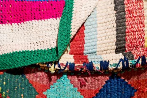 Abstract texture of a colorful blanket patchwork Stock Photos